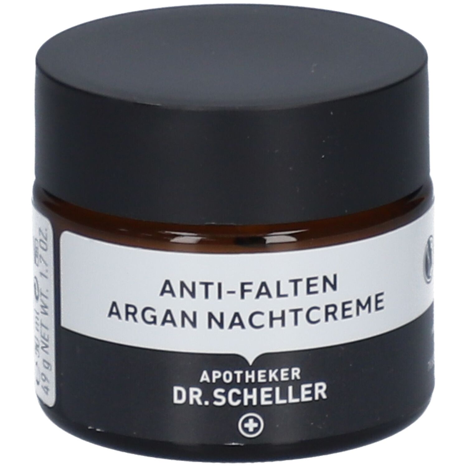 Pot de crème de nuit anti-rides à l'argan. Verre brun, couvercle noir. Étiquette blanche avec nom du produit.