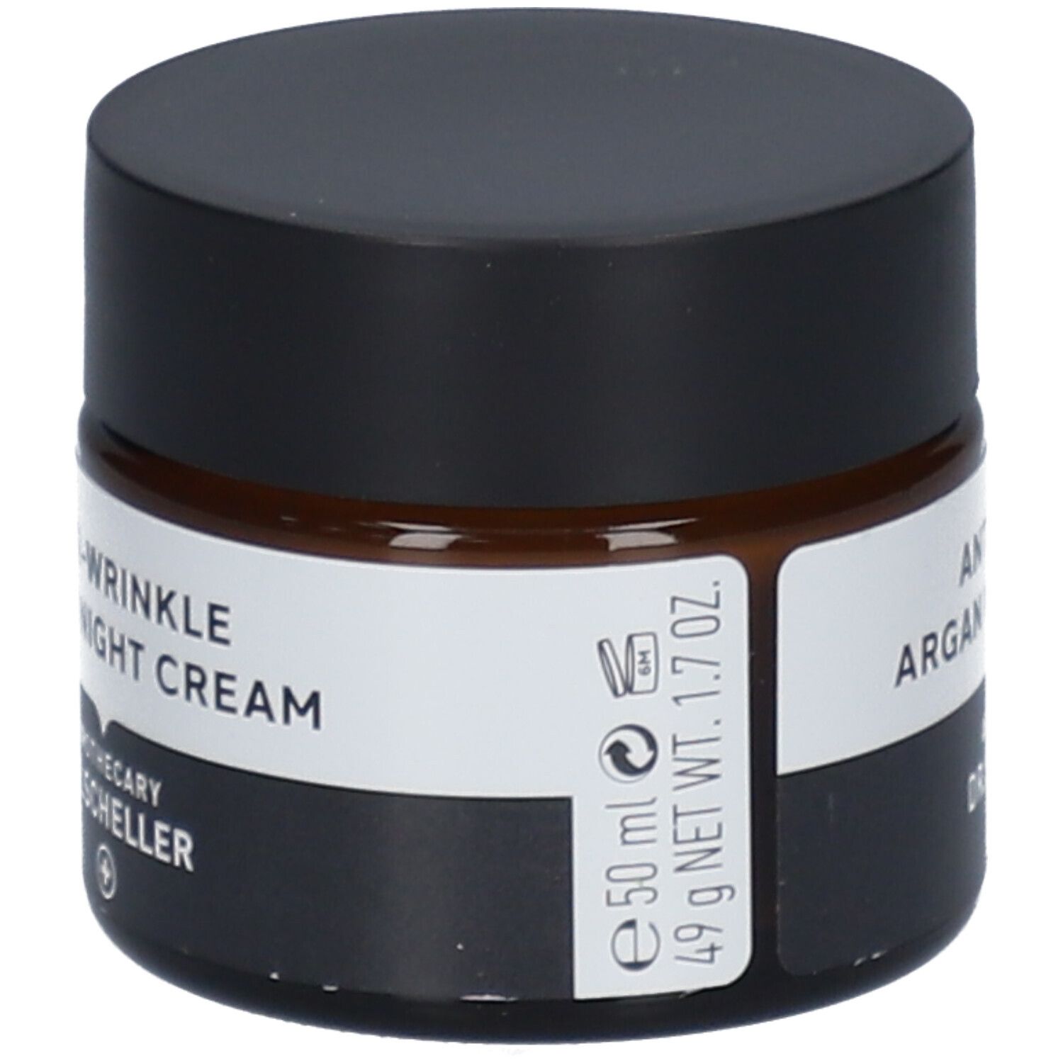 Pot de crème de nuit anti-rides à l'argan. Verre brun, couvercle noir. Étiquette blanche avec nom du produit.