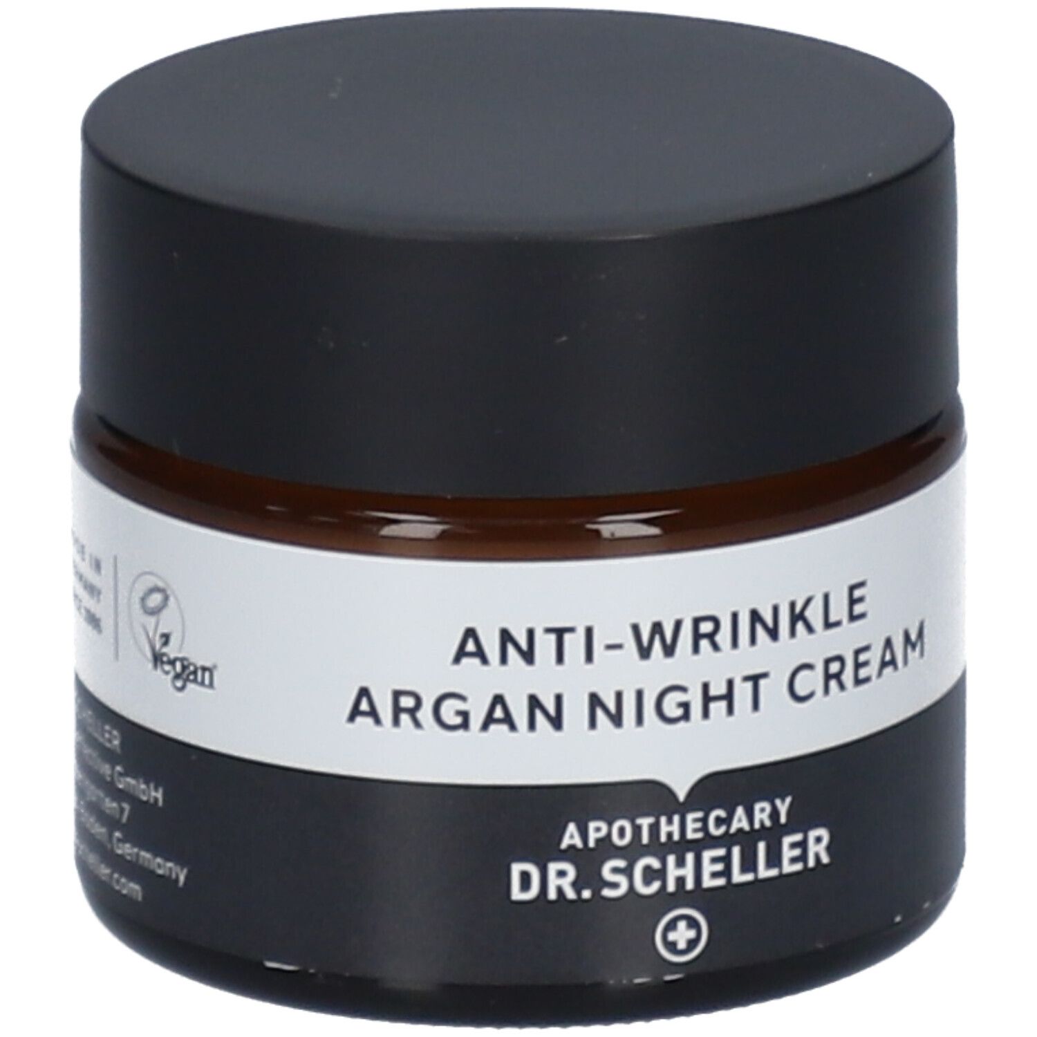 Pot de crème de nuit anti-rides à l'argan. Verre brun, couvercle noir. Étiquette blanche avec nom du produit.