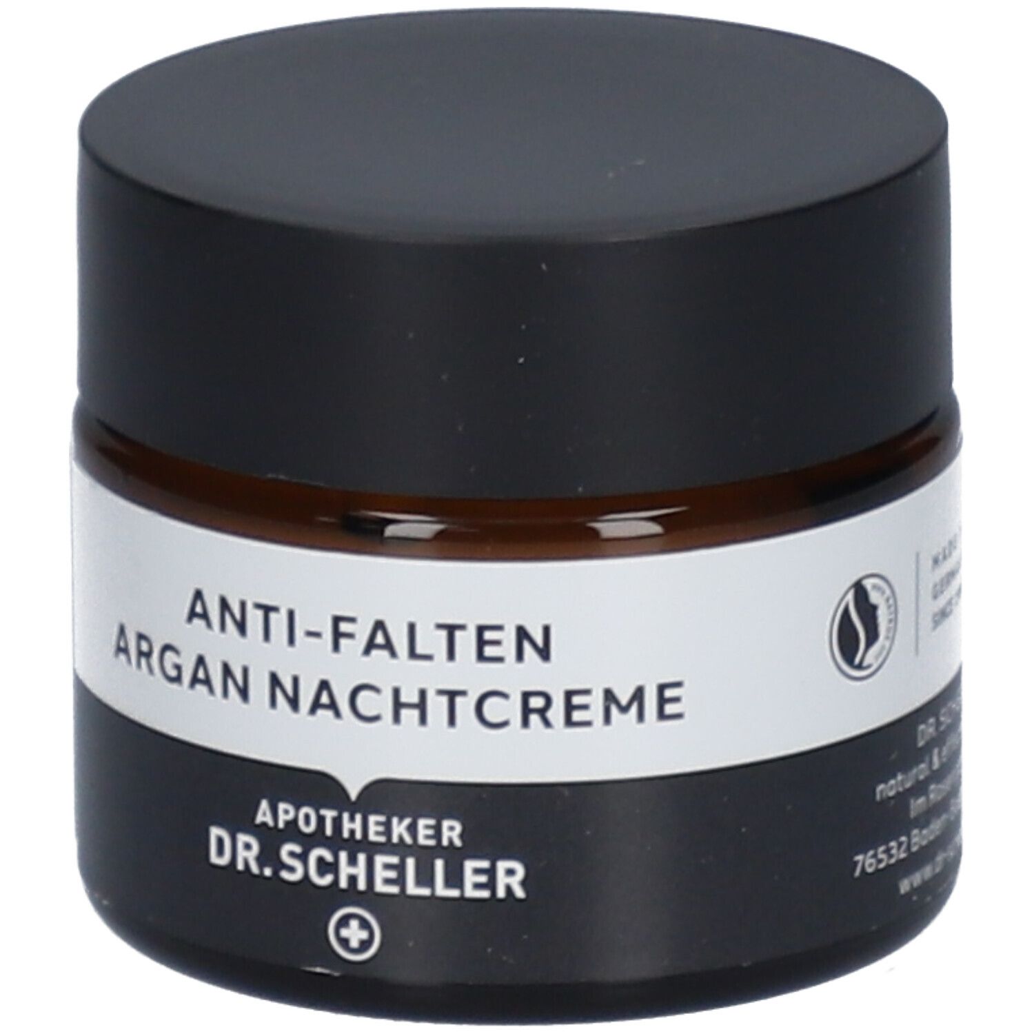 Pot de crème de nuit anti-rides à l'argan. Verre brun, couvercle noir. Étiquette blanche avec nom du produit.