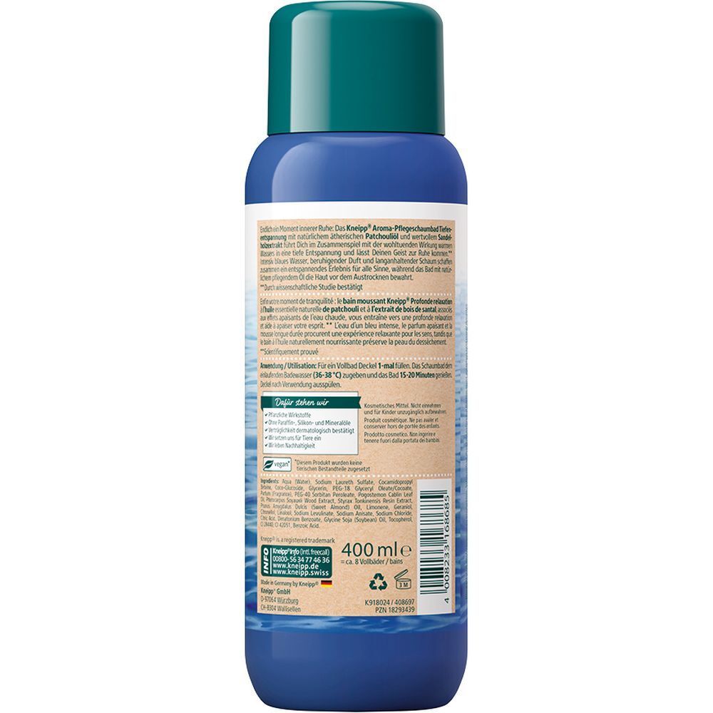 Achterkant van de blauwe fles met groene dop. Tekst in meerdere talen. Indicatie van 400 ml.