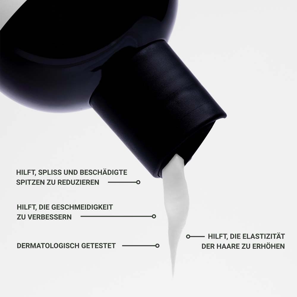 Close-up van de conditioner. Tekst: Helpt gespleten punten te verminderen, zachtheid te verbeteren, elasticiteit te verhogen. Dermatologisch getest.