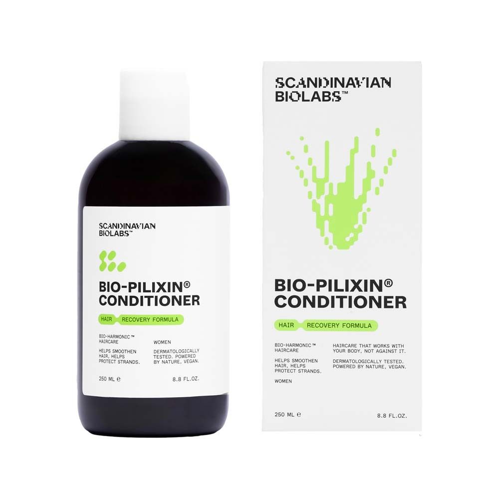 Donkere fles met witte dop en verpakking. Opschrift: Bio-Pilixin Conditioner. Groen-witte grafiek.