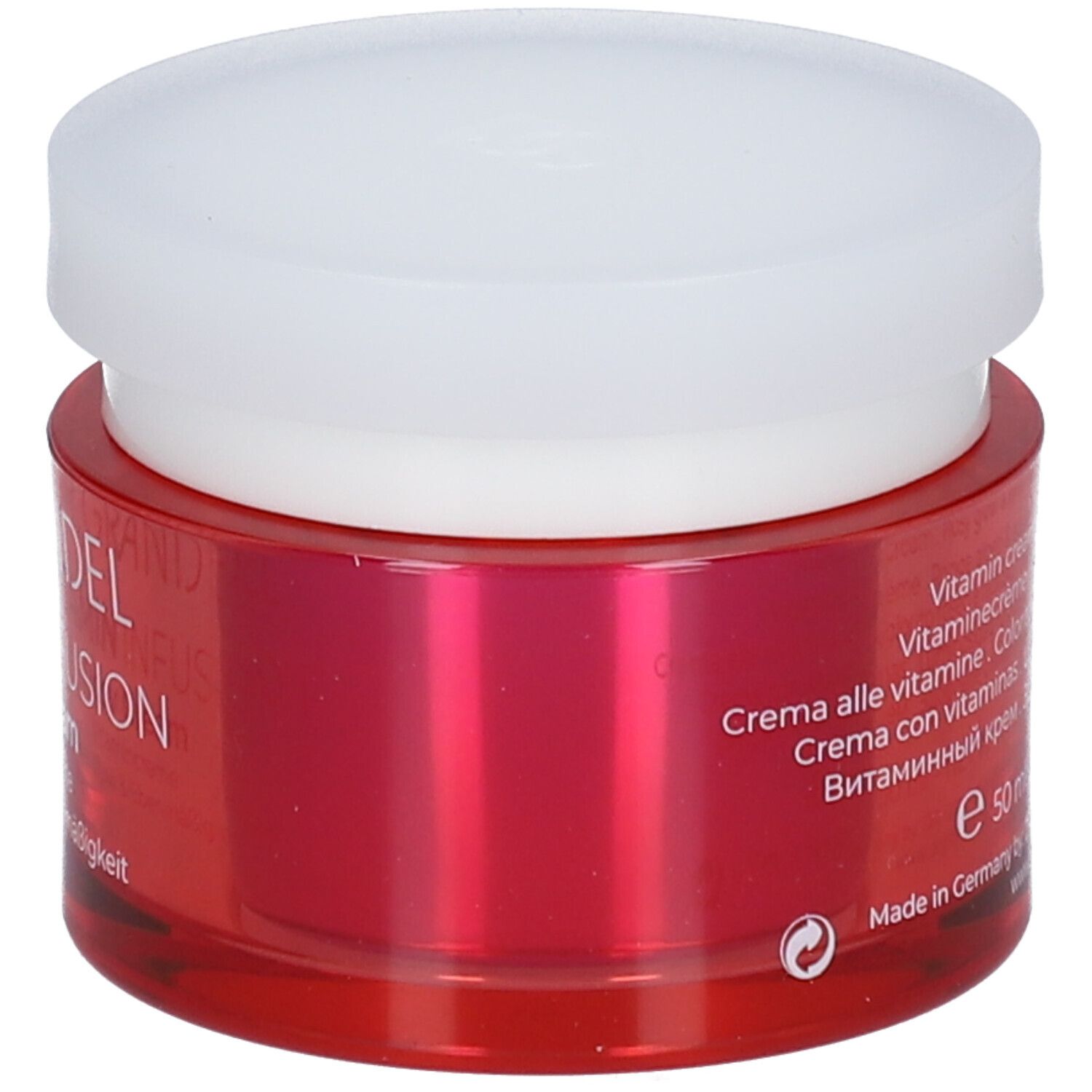 Pot rouge avec couvercle blanc. Inscription: DR. GRANDEL Vitamin Infusion. Texte en plusieurs langues. Fabriqué en Allemagne.