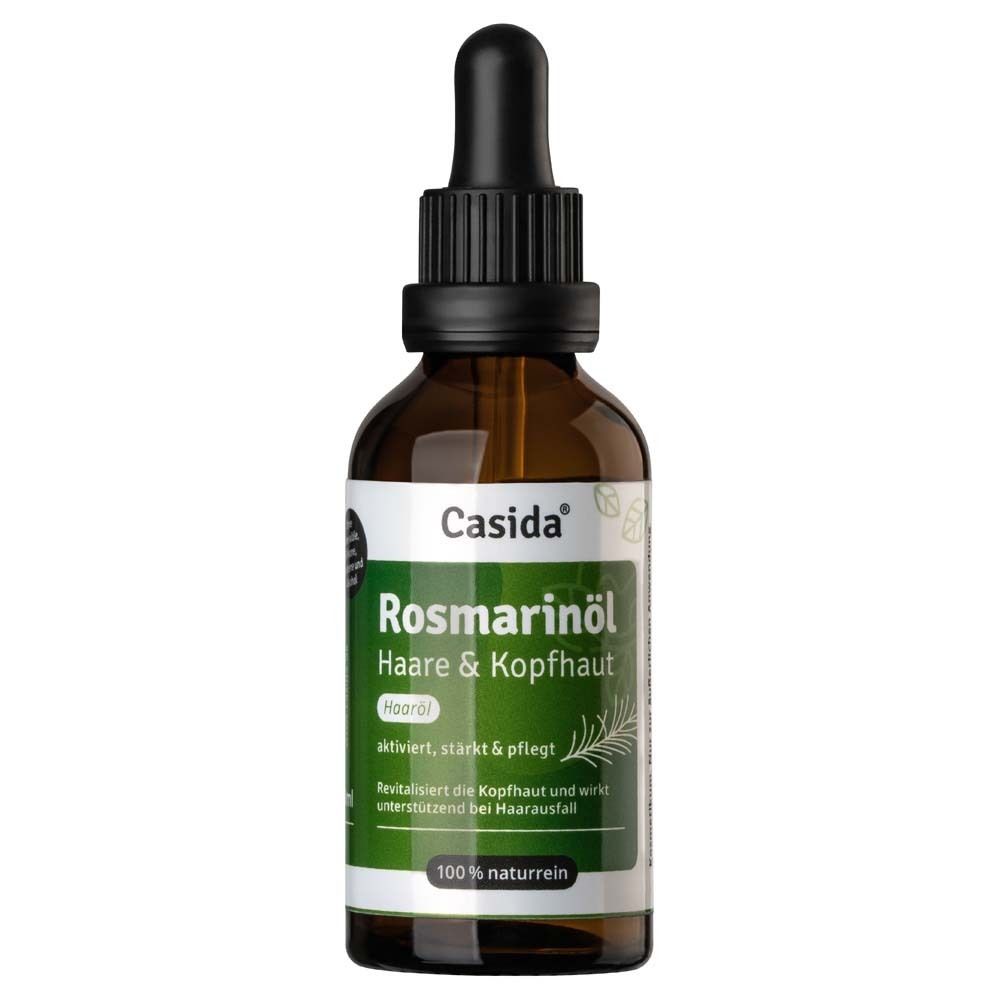 Bruine glazen fles met druppelaar. Etiket met "Casida Rozemarijnolie Haar & Hoofdhuid" en "100% puur natuur".