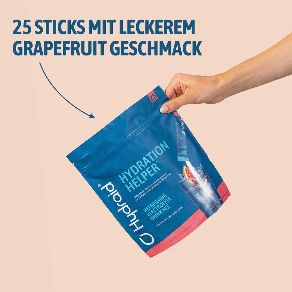 Hand houdt zak Hydraid Hydration Helper Grapefruitsmaak vast. 25 sticks voor verfrissende elektrolytendrankjes.