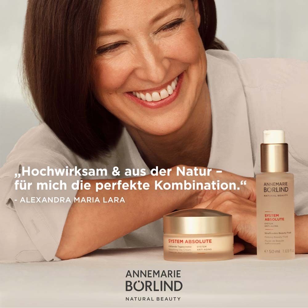 Femme avec produits Börlind System Absolute. Citation: Très efficace et issu de la nature - Alexandra Maria Lara.