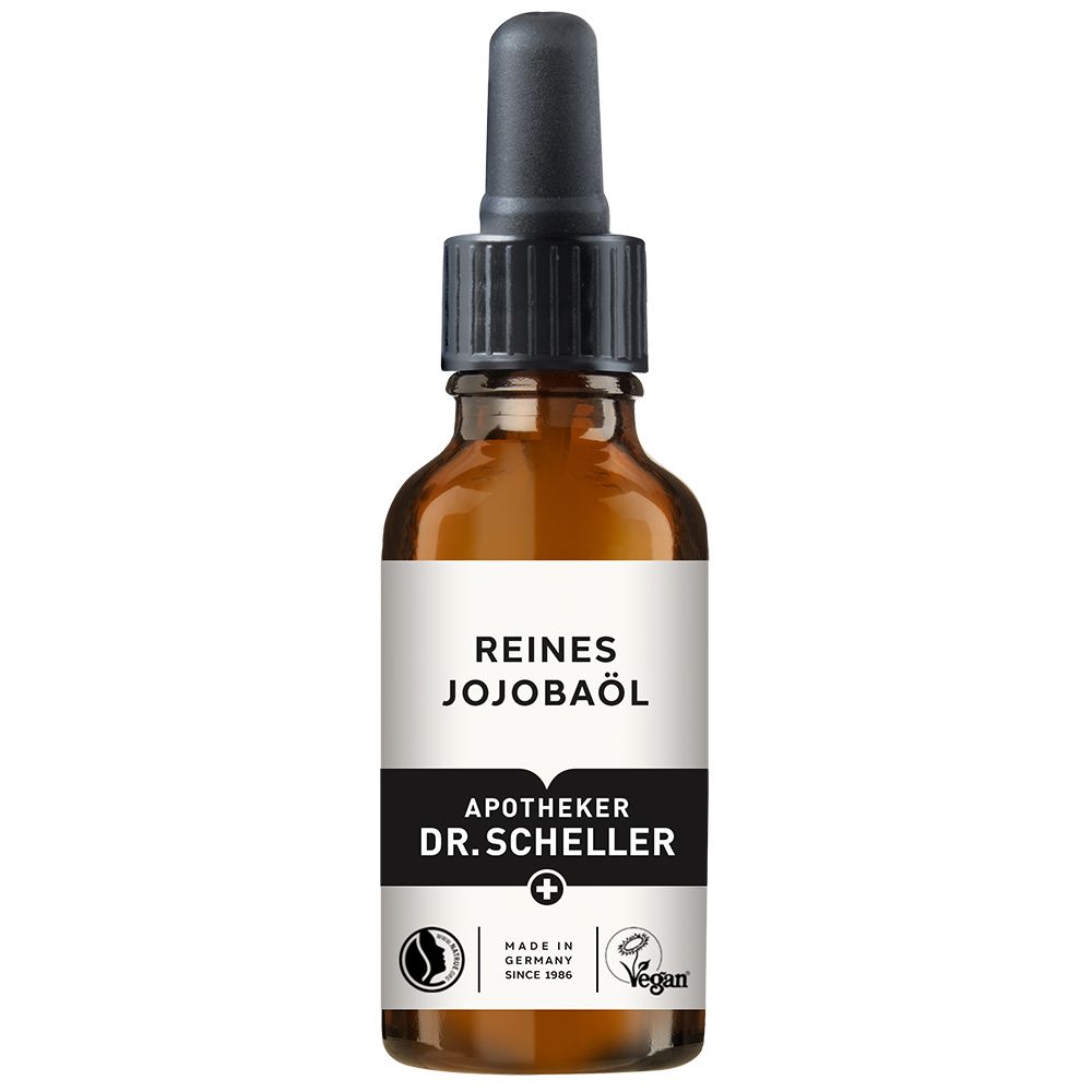 Flacon en verre brun avec pipette. Étiquette avec texte: REINES JOJOBAÖL, Apotheker DR.SCHELLER. Vegan. Fabriqué en Allemagne.