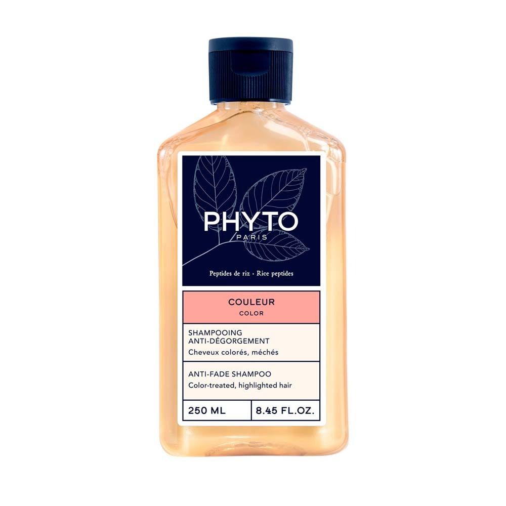 Fles PHYTO PARIS shampoo, kleur, met blauwe dop. Label met logo en productinformatie.