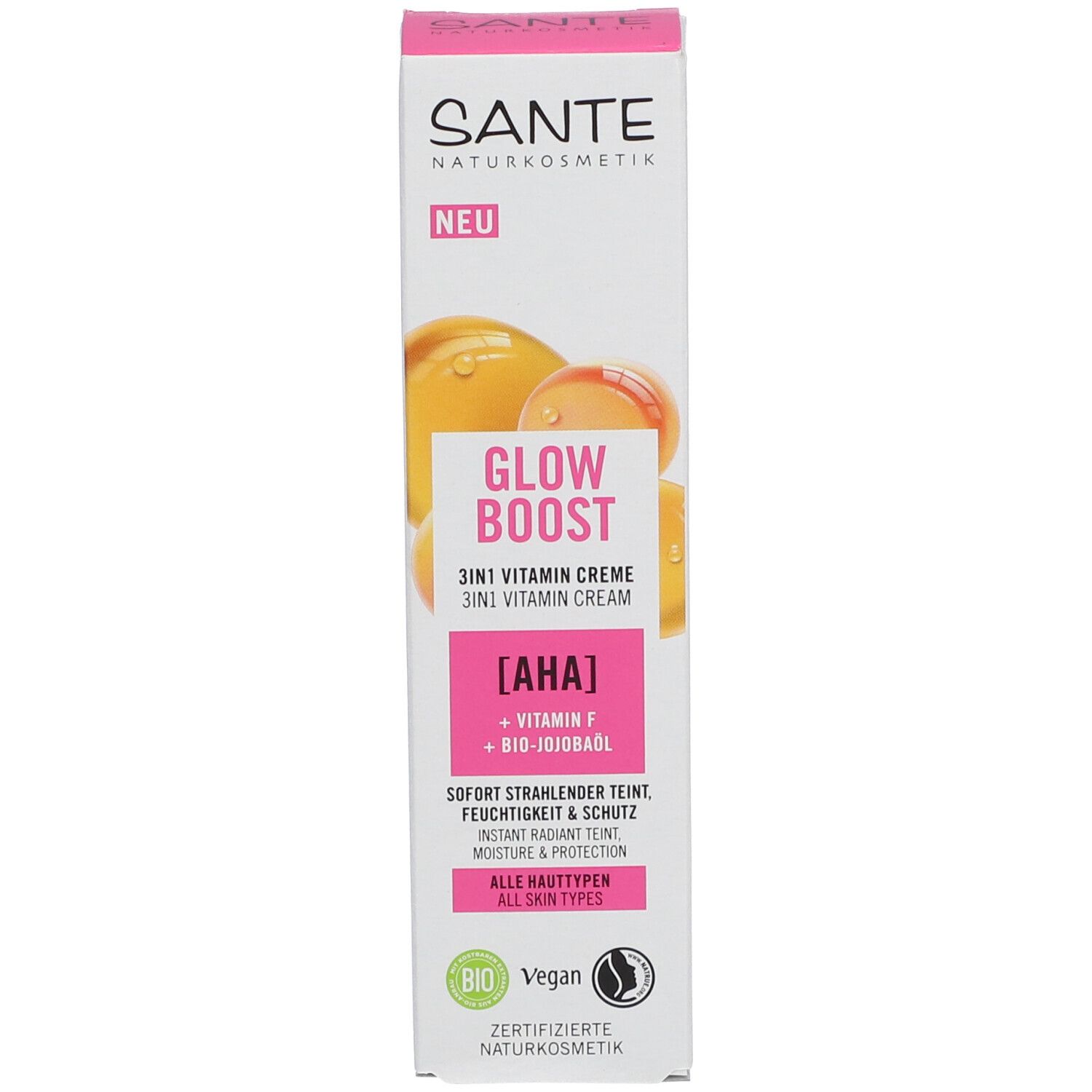 Emballage de la crème SANTE GLOW BOOST. Inscription : GLOW BOOST 3in1 Vitamin Creme. Contient AHA, Vitamine F, huile de jojoba bio. Tous types de peau.