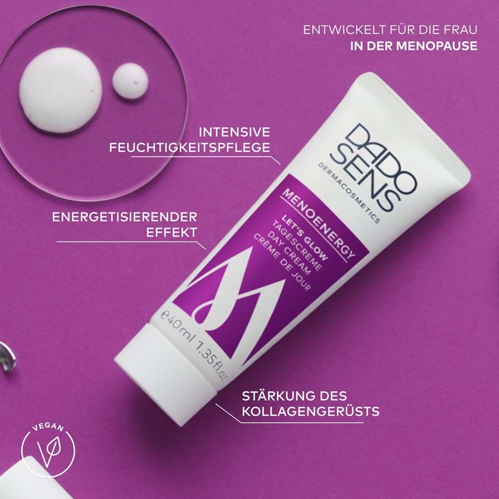 Tube met paarse accenten, druppels crème. Tekst: MENOENERGY, LET'S GLOW Day Cream. Vegan logo.