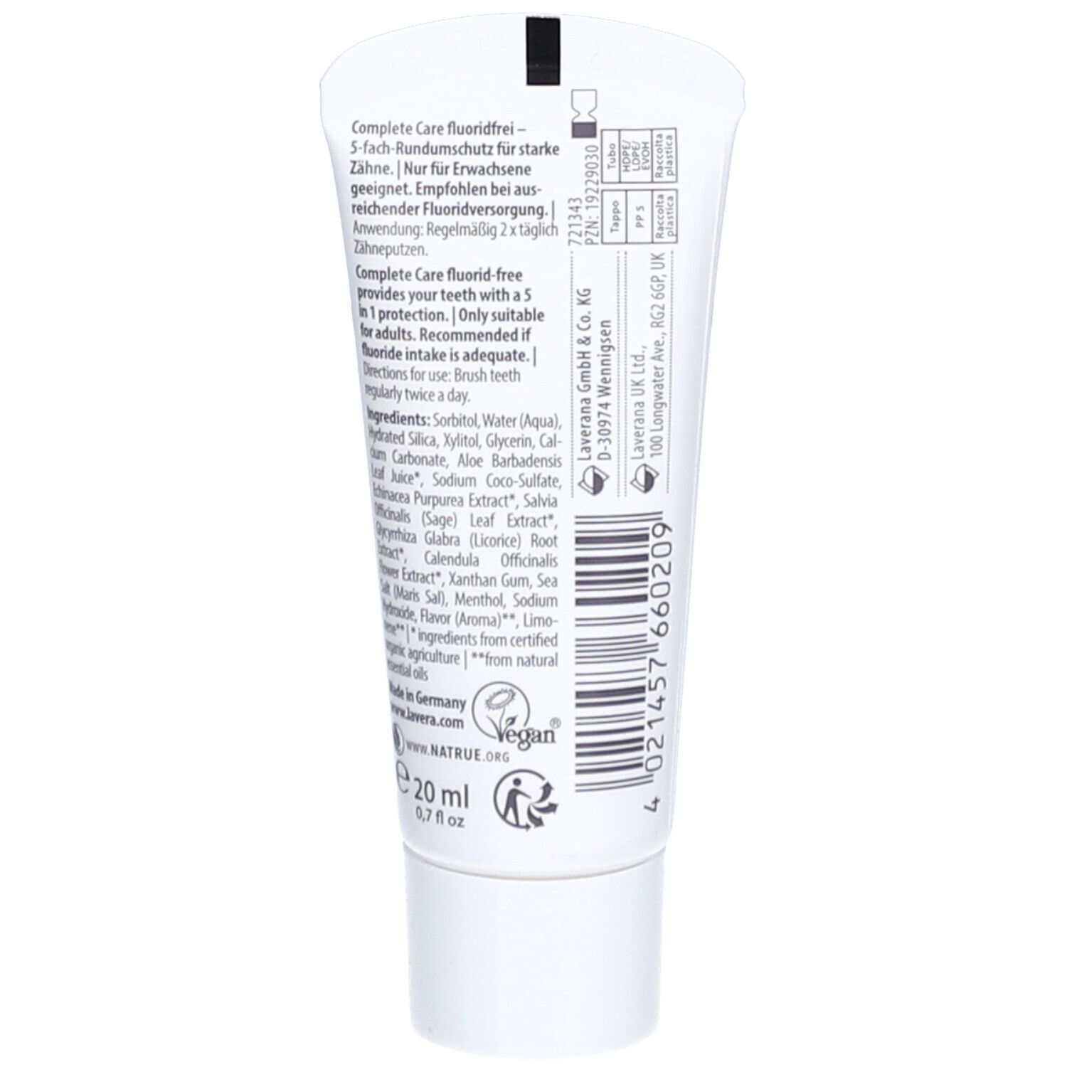 Witte tube van 20 ml Complete Care fluoridevrije tandpasta. Bevat ingrediënten en gebruiksinstructies.
