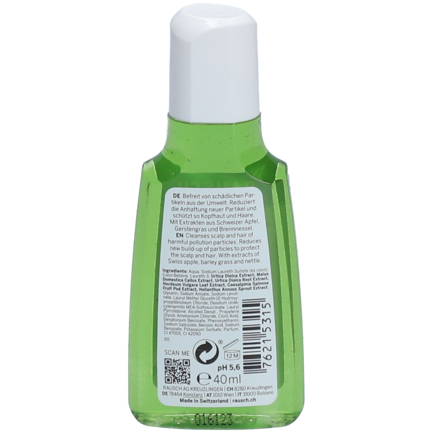 Dos du flacon vert. Texte: Nettoie le cuir chevelu et les cheveux. Avec extraits de pomme suisse, orge et ortie. pH 5,6.