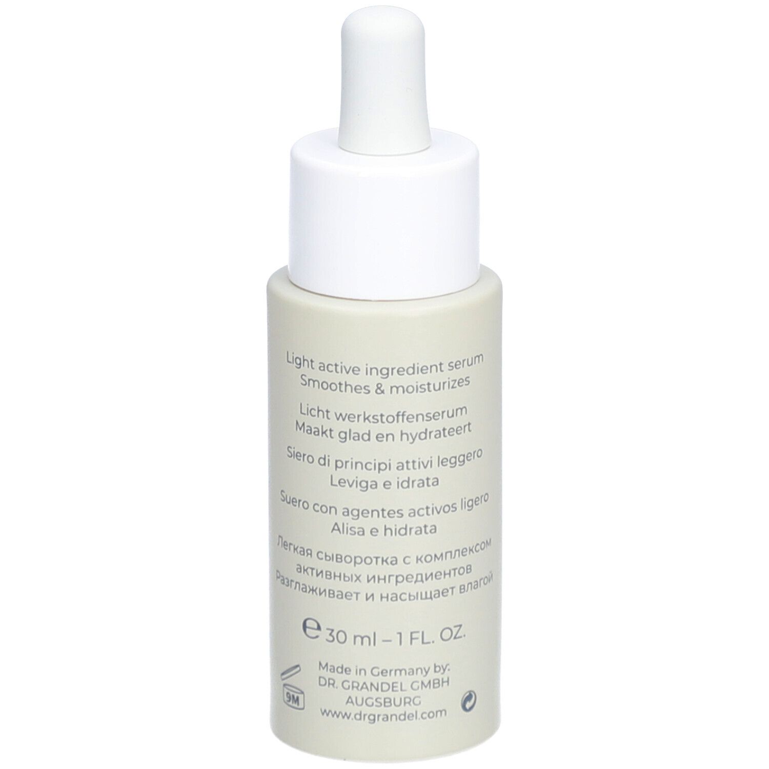 Dos du flacon de sérum beige. Texte multilingue, dont 30 ml - 1 FL. OZ. et DR. GRANDEL.