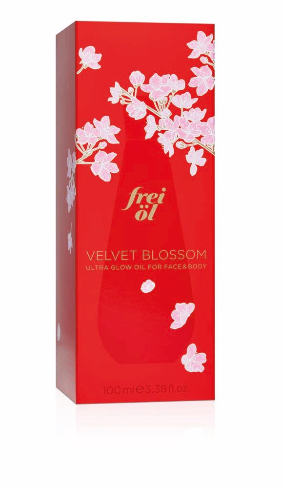 Emballage rouge avec motif floral. Inscription : frei öl, Velvet Blossom, Ultra Glow Oil for Face & Body.