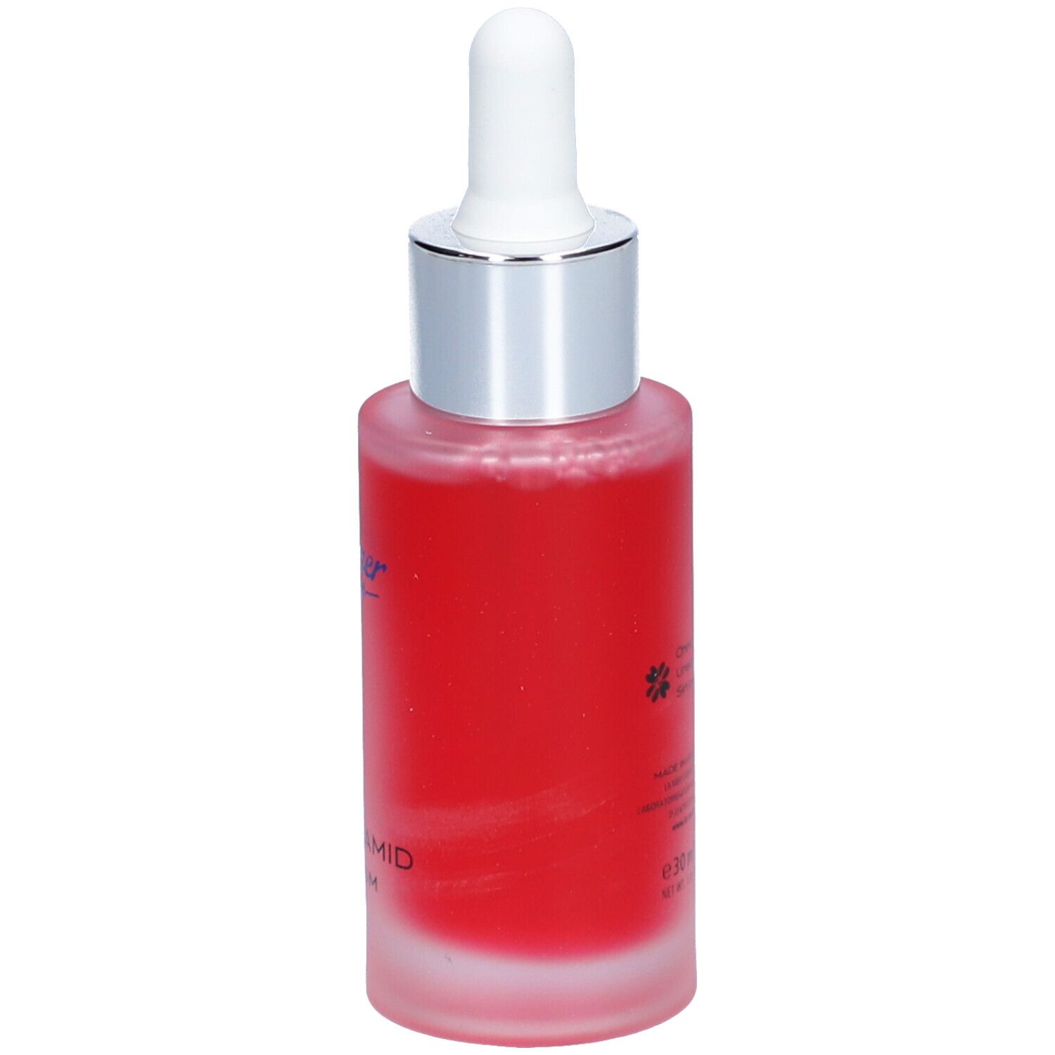 Flacon de sérum rouge avec pipette. Inscription : La mer, Niacinamid Serum.