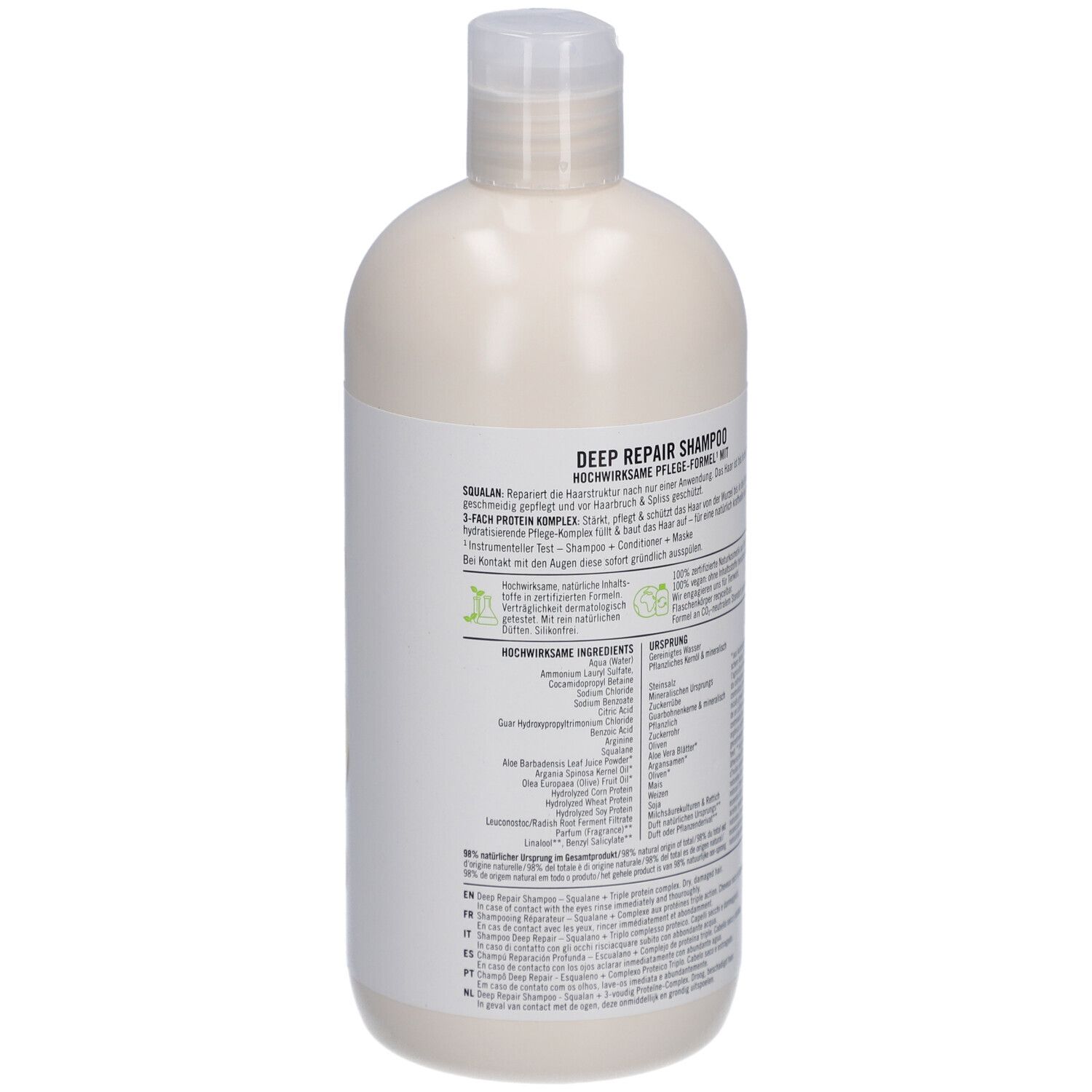 Dos d'un flacon de shampooing beige avec bouchon blanc. Texte multilingue. Label Vegan.