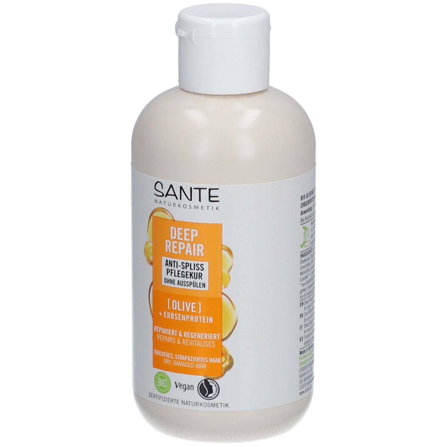 Beige fles met witte dop. Etiket met productinformatie en logo.