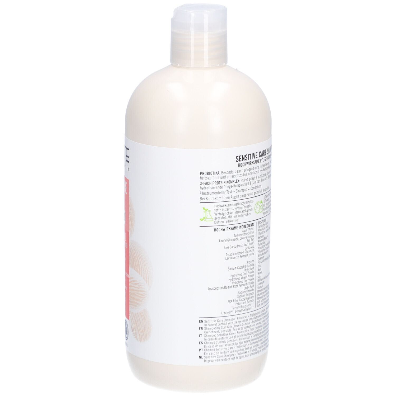 Achterkant van een beige shampoo fles met witte dop. Tekst op wit etiket. Ingrediënten en informatie.