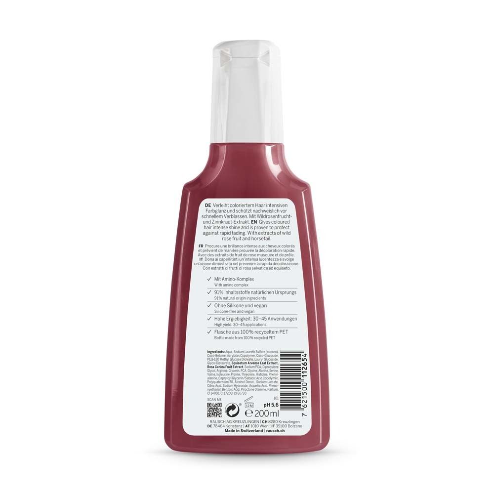 Achterkant van de kleurbeschermende shampoo fles. Tekst in het Duits en Engels. Ingrediënten, certificeringen en QR-code. Fles van gerecycled PET.