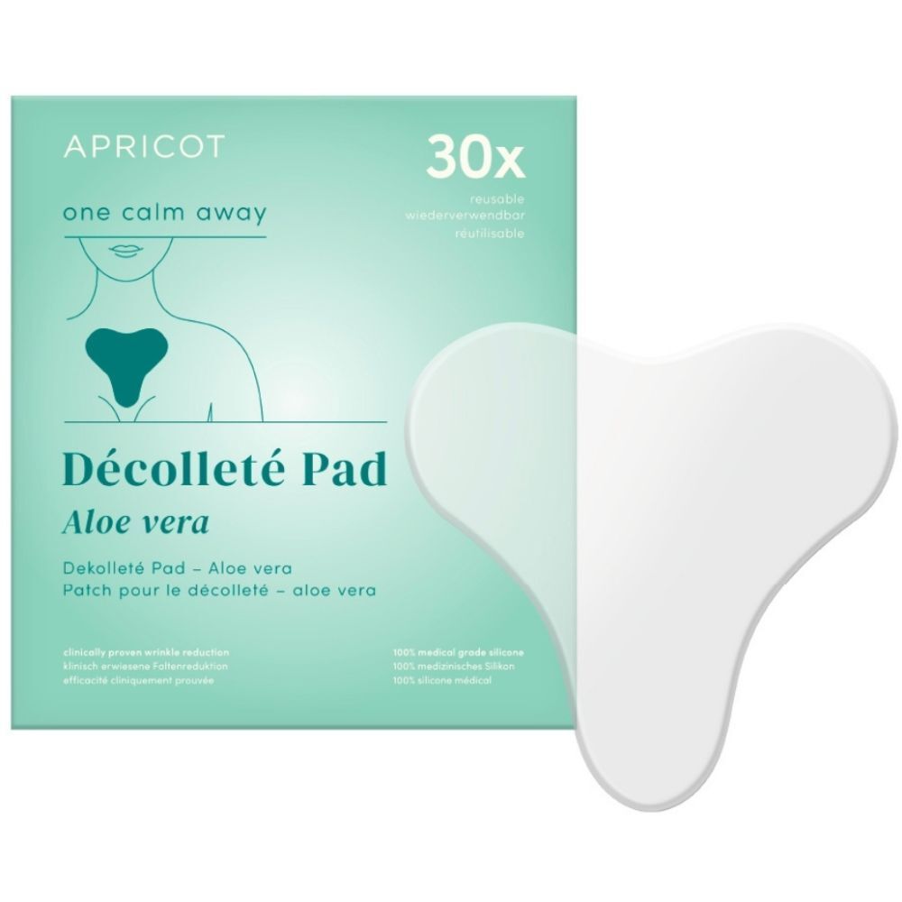 Coussinet décolleté blanc en forme de cœur à côté d'un emballage. Emballage avec nom du produit, marque APRICOT et 30 pièces.