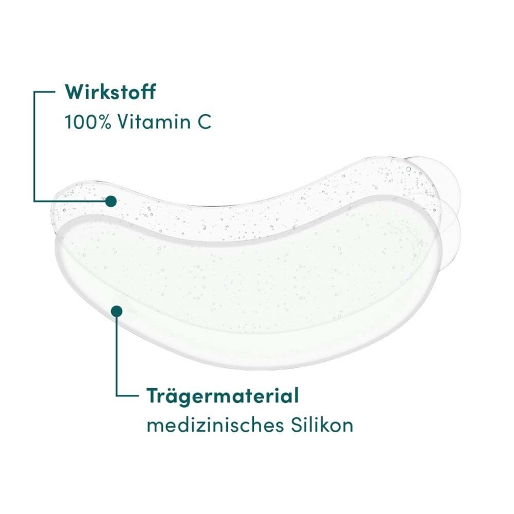 Coussinet oculaire avec informations sur les ingrédients. Ingrédient actif : 100% vitamine C. Support : silicone médical.