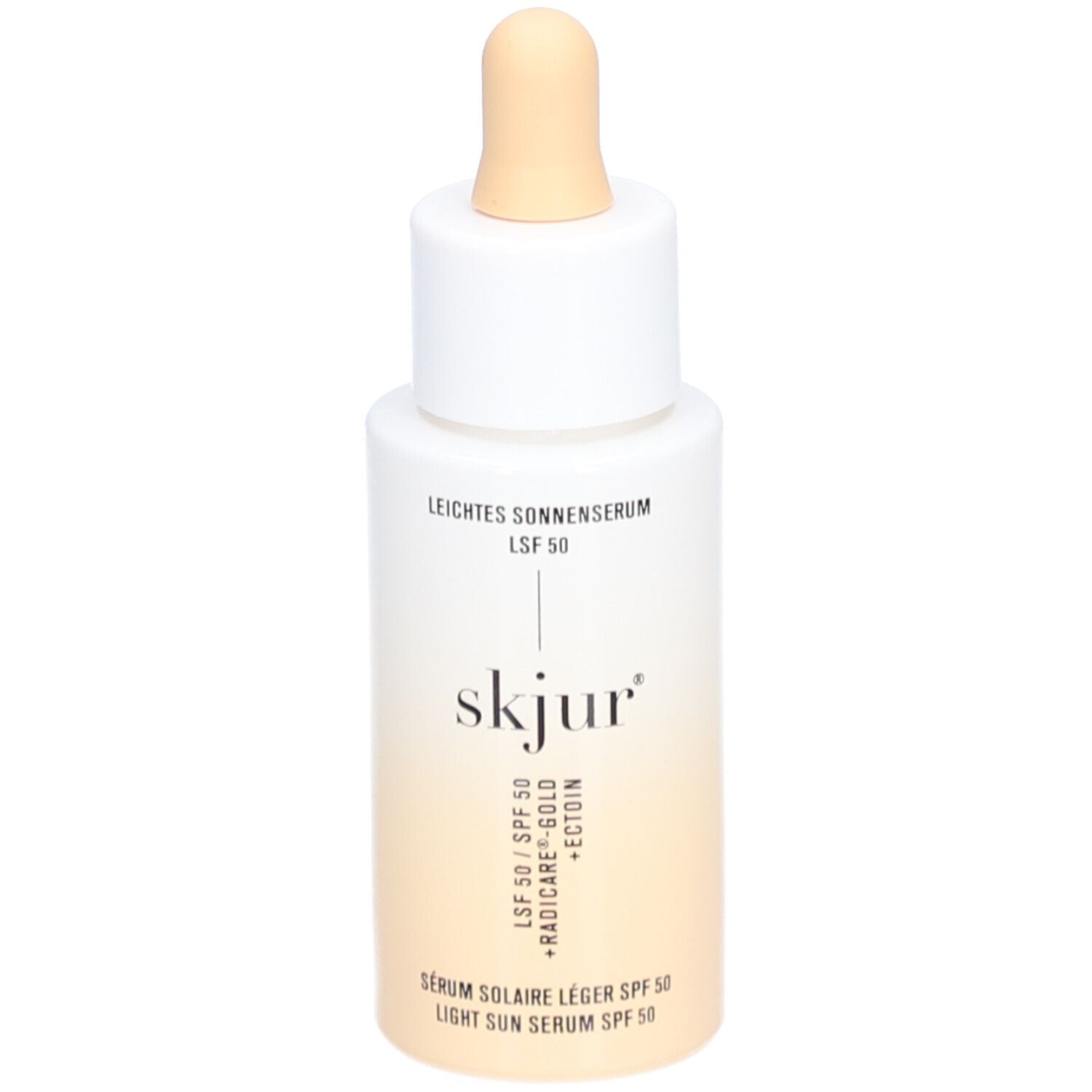 Wit-beige fles met pipet. Opschrift: Leichtes Sonnenserum LSF 50, skjur, Sérum solaire léger SPF 50, Light Sun Serum SPF 50.