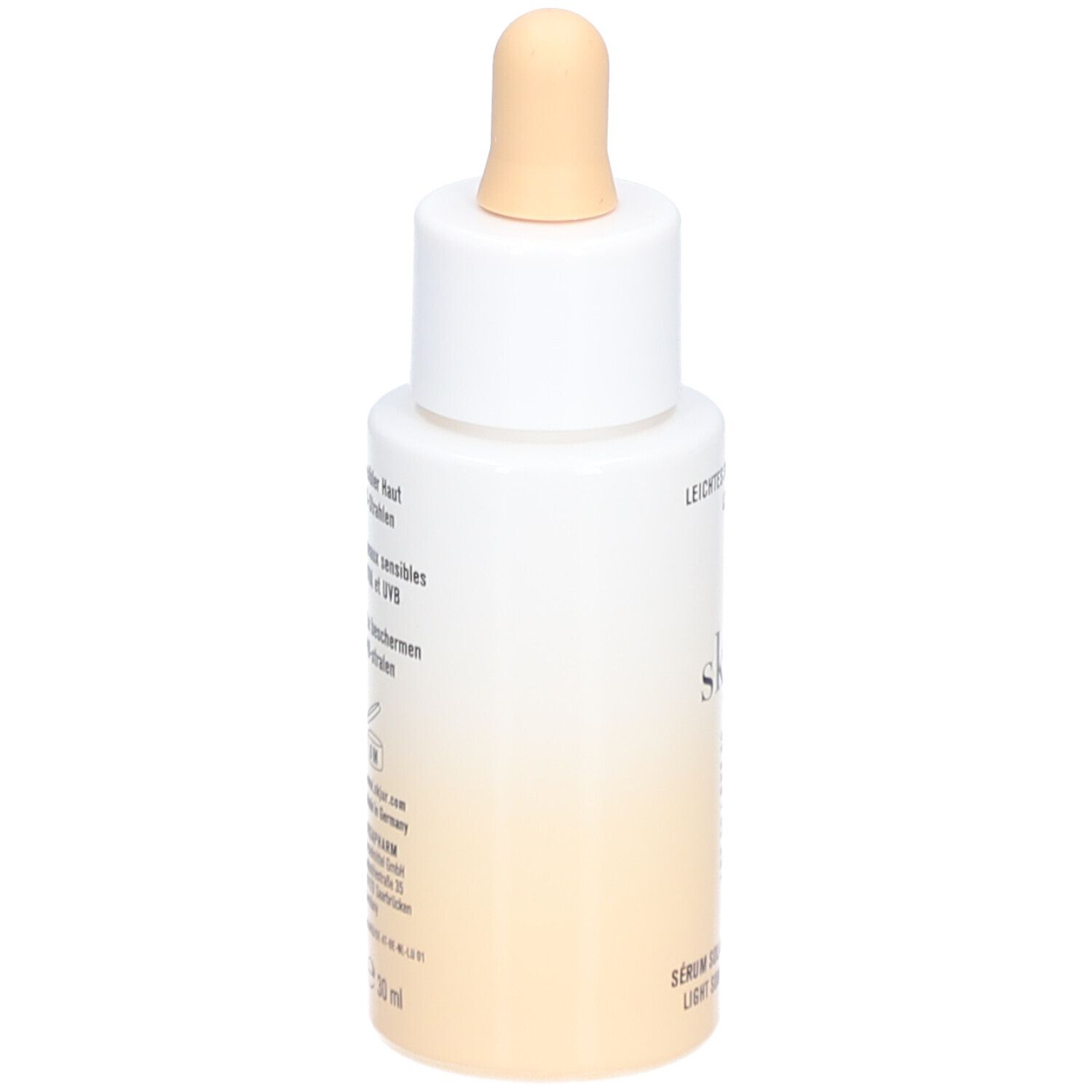 Achterkant van de fles. Opschrift: Leichtes Sonnenserum LSF 50, skjur. Tekst voor gevoelige huid. 30 ml.