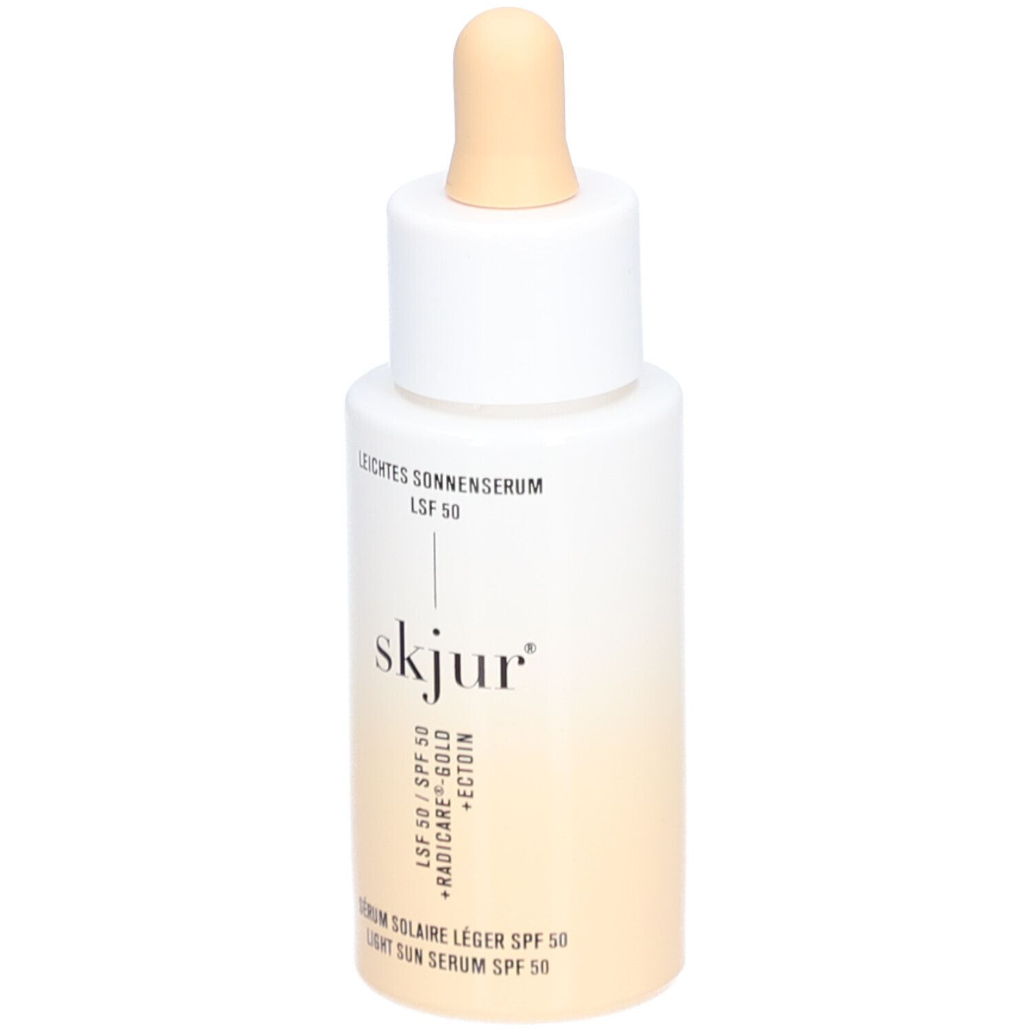 Wit-beige fles met pipet. Opschrift: Leichtes Sonnenserum LSF 50, skjur, Sérum solaire léger SPF 50, Light Sun Serum SPF 50.