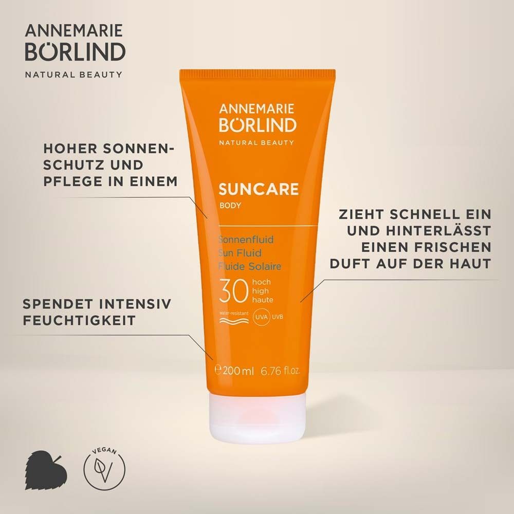 Tube orange de fluide solaire LSF 30 Annemarie Börlind. Texte : Protection solaire élevée, hydrate.