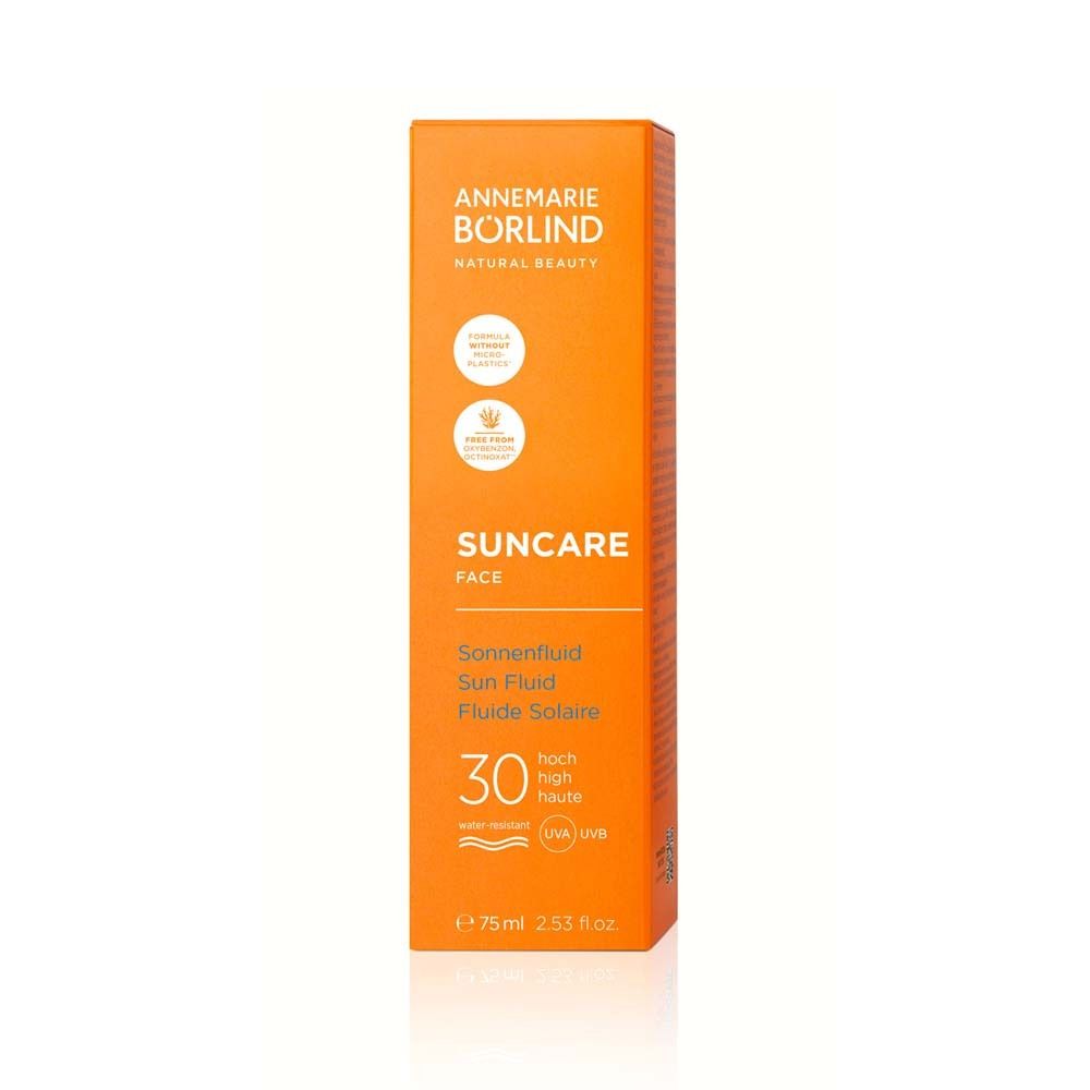 Boîte orange avec fluide solaire LSF 30. Texte : Suncare Face. Logos.