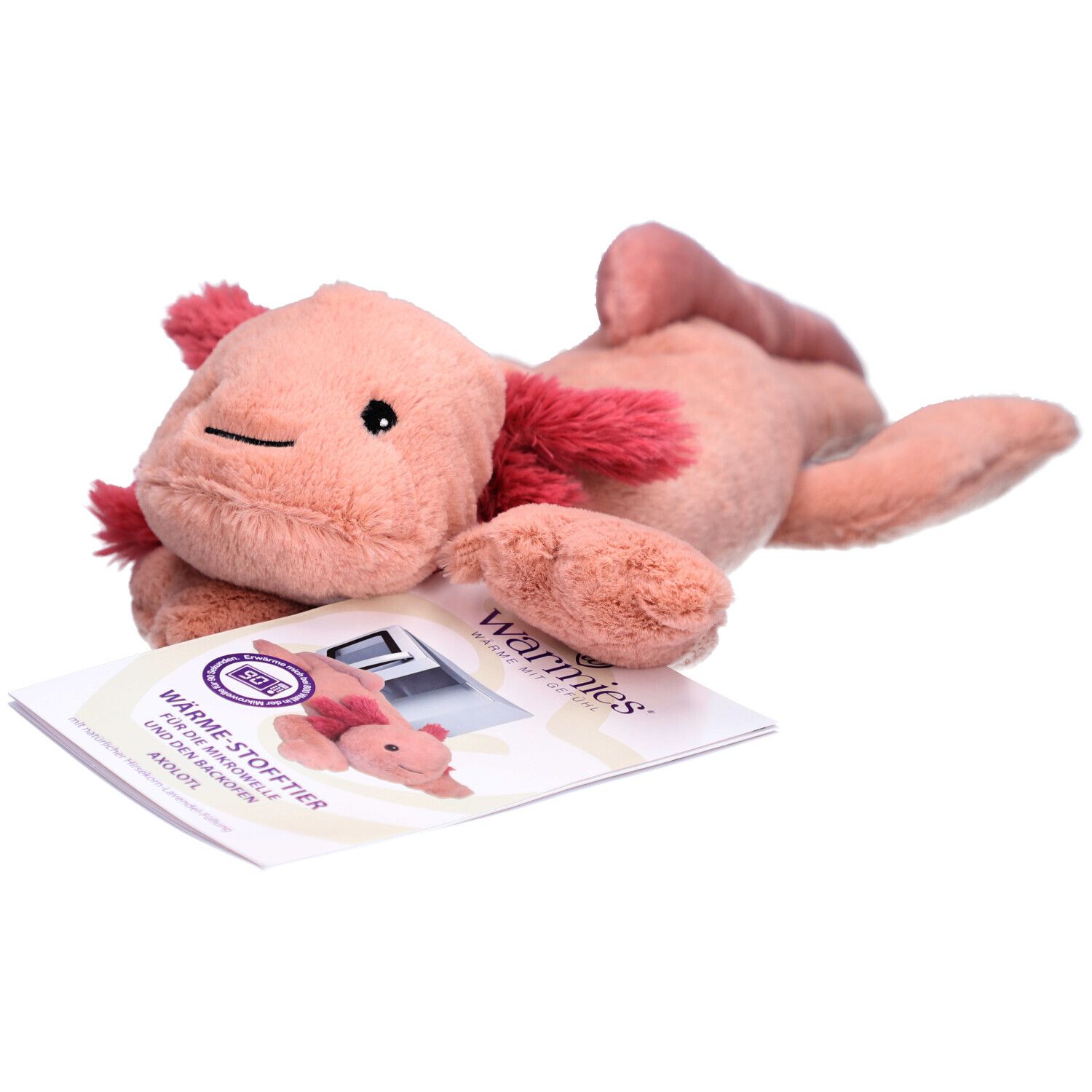 Roze axolotl knuffel met rode kieuwen. Naast een brochure met productafbeelding.