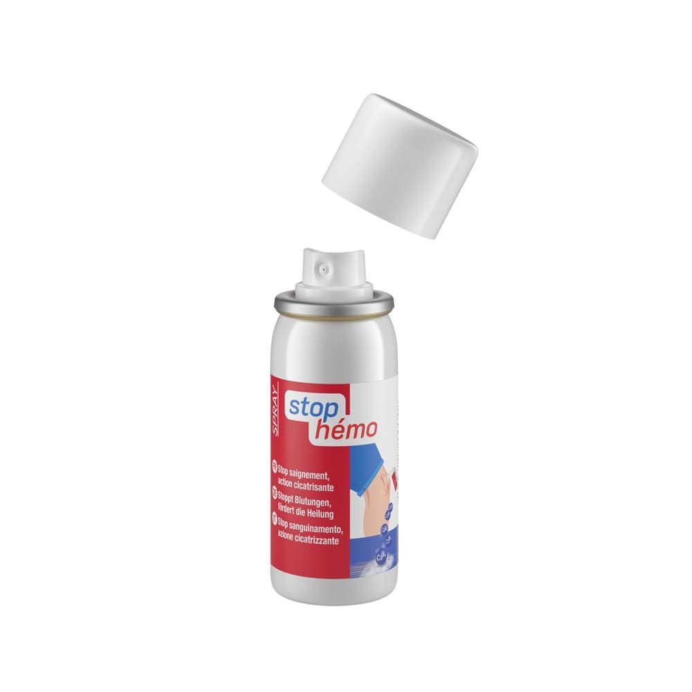 Flacon spray blanc avec bouchon enlevé. Inscription : stop hémo. Texte en français, allemand, italien.