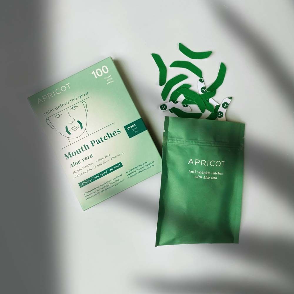 Emballage, sachet et patchs buccaux. Inscription : APRICOT, Mouth Patches, Aloe Vera. Vert.
