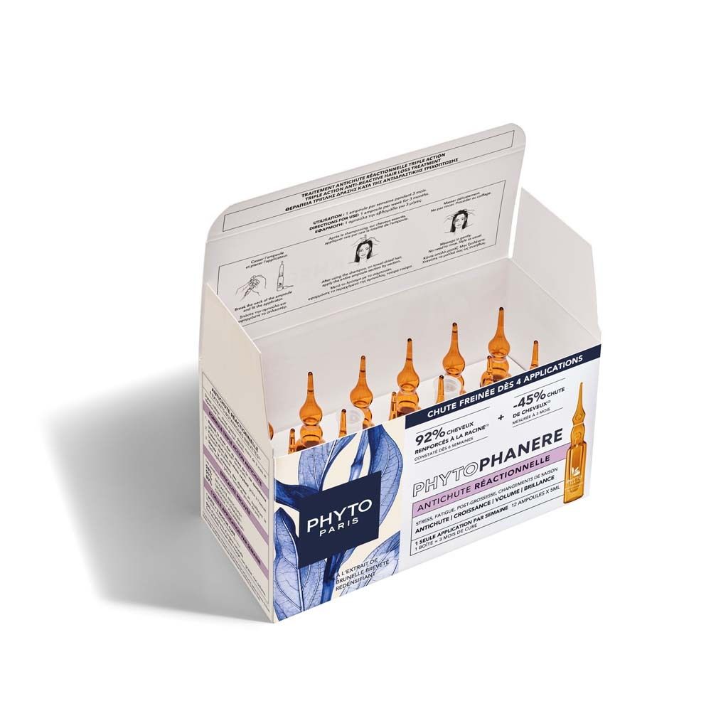 Open verpakking met Phytophanere ampullen. 12 ampullen zichtbaar. Opschrift: Phytophanere, reactieve haaruitval. Gebruiksinformatie.