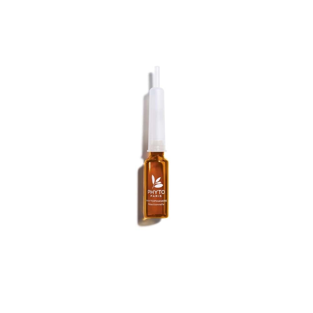 Enkele ampul met vloeistof. Opschrift: Phytophanere. Transparante ampul met witte applicator. Bruine vloeistof zichtbaar.