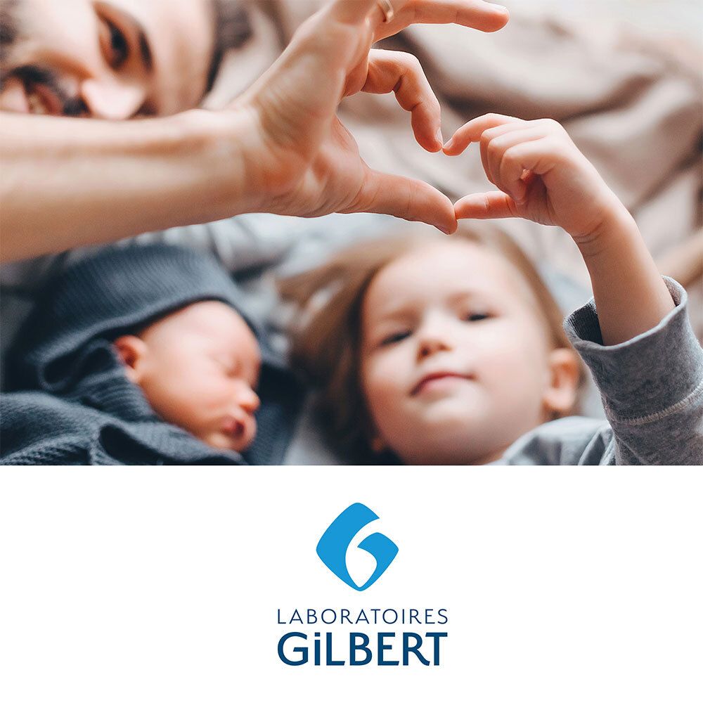 Ouders en kinderen vormen hart. Logo: Laboratoires Gilbert.