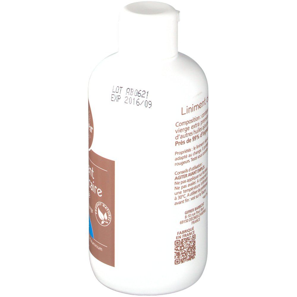 Flacon blanc avec étiquette marron. Inscription: Liniment oléo-calcaire. Texte et QR code. Avec bouchon.