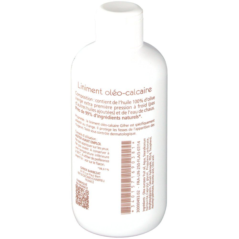 Flacon blanc avec texte sur étiquette marron. Inscription: Liniment oléo-calcaire. Avec bouchon.