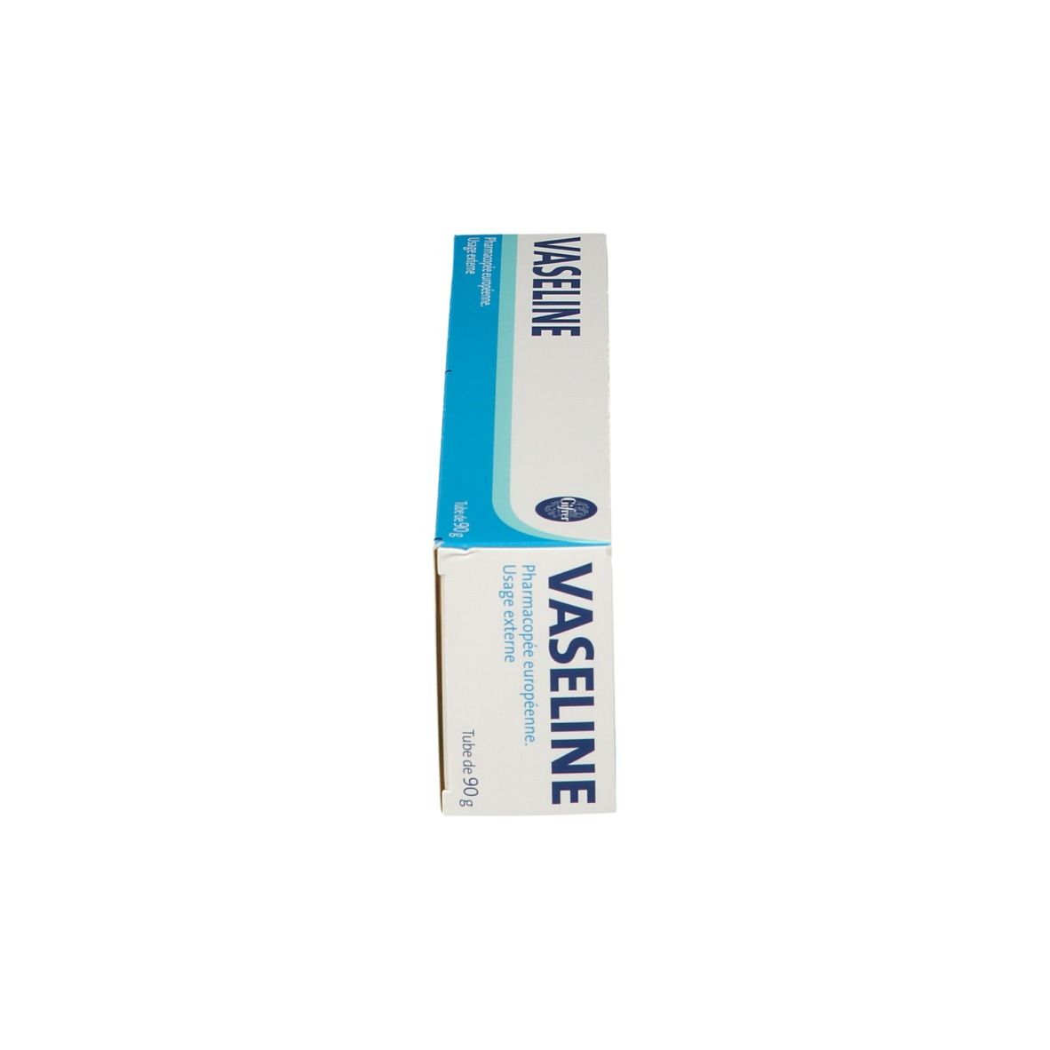 Boîte de vaseline blanche, verticale. Inscription: Vaseline. Emballage: bleu et blanc.