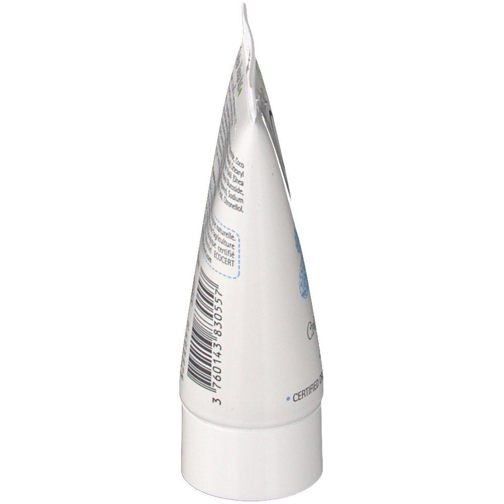 Vue latérale d'un tube blanc. Texte avec ingrédients et informations. Bouchon à vis blanc.