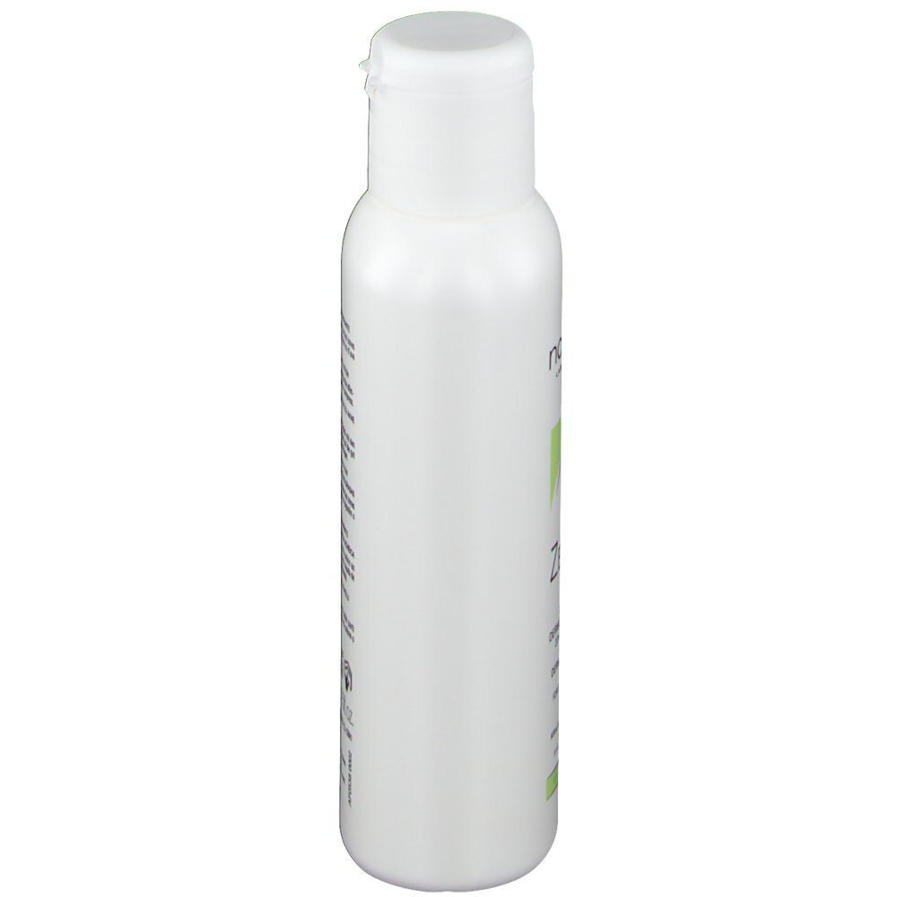 Witte fles met klapdeksel. Opschrift niet zichtbaar.