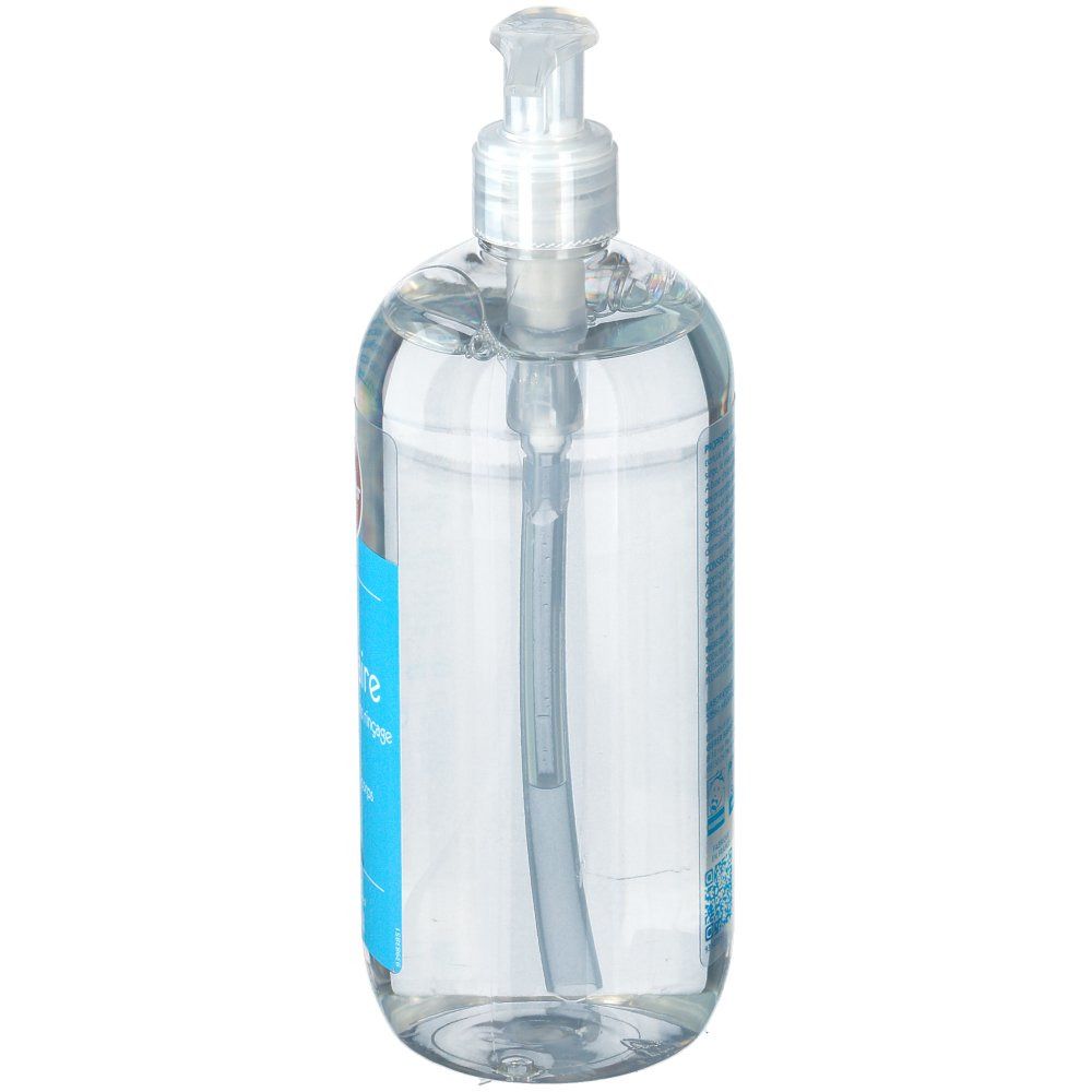 Flacon transparent avec pompe. Vue latérale de l'étiquette bleue.