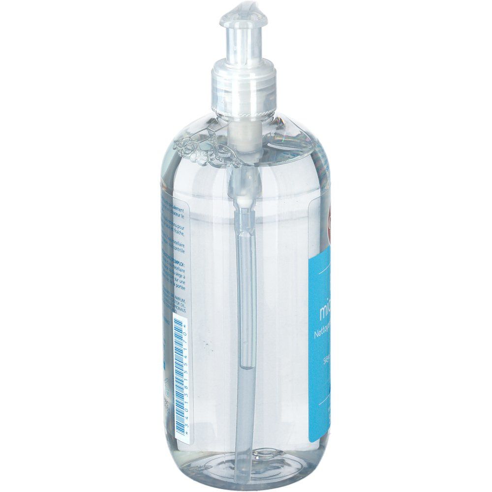 Flacon transparent avec pompe. Vue latérale de l'étiquette bleue.