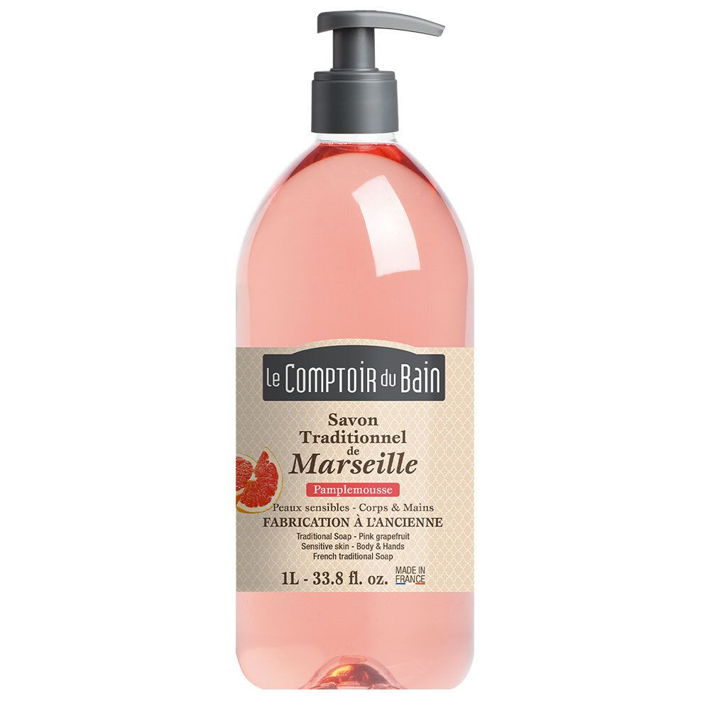 Roze grapefruitzeep in een transparante fles met pomp. Etiket met productinformatie en logo.