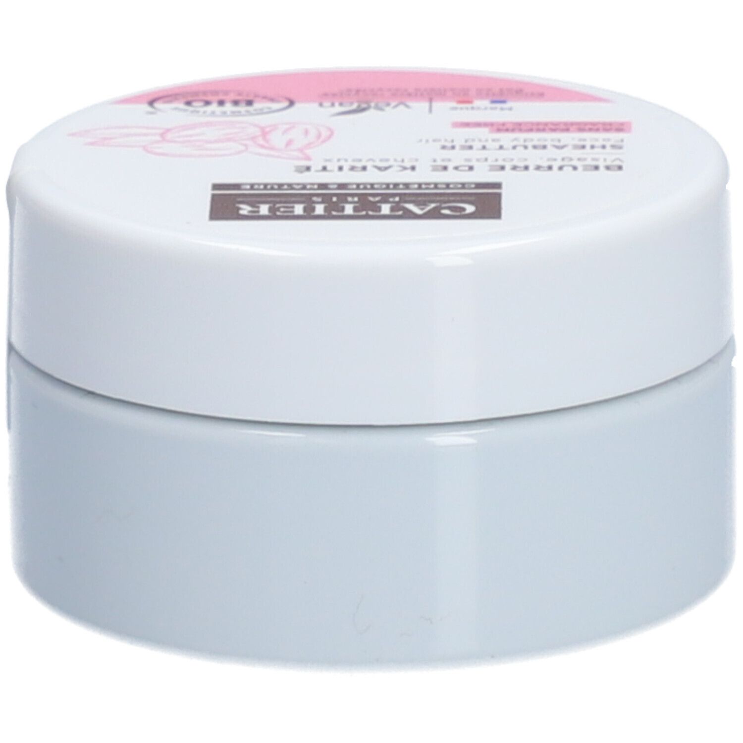 Witte pot met deksel. Opschrift: Cattier, Beurre de Karité, Shea Butter, Bio-label. Roze en bruine accenten.