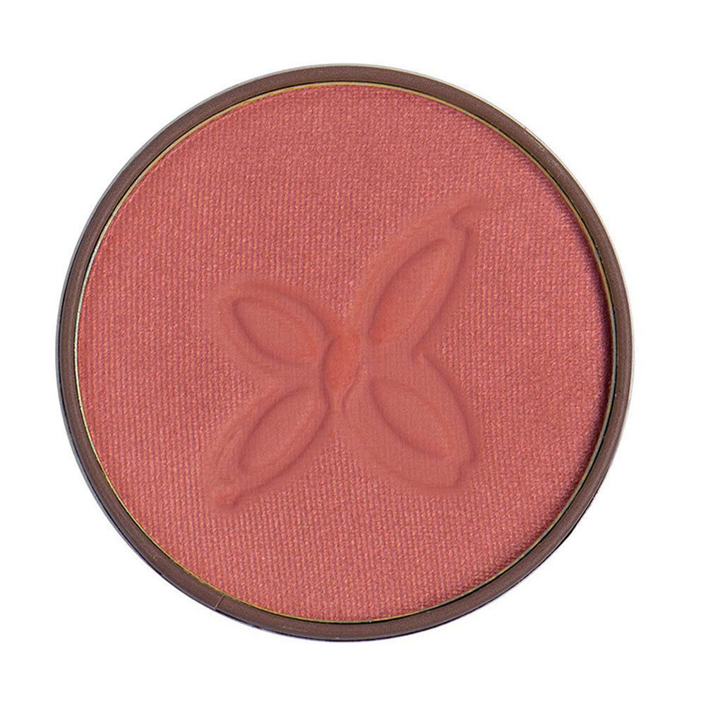 Boîte ronde de fard à joues rose. Motif en relief. Bord marron.