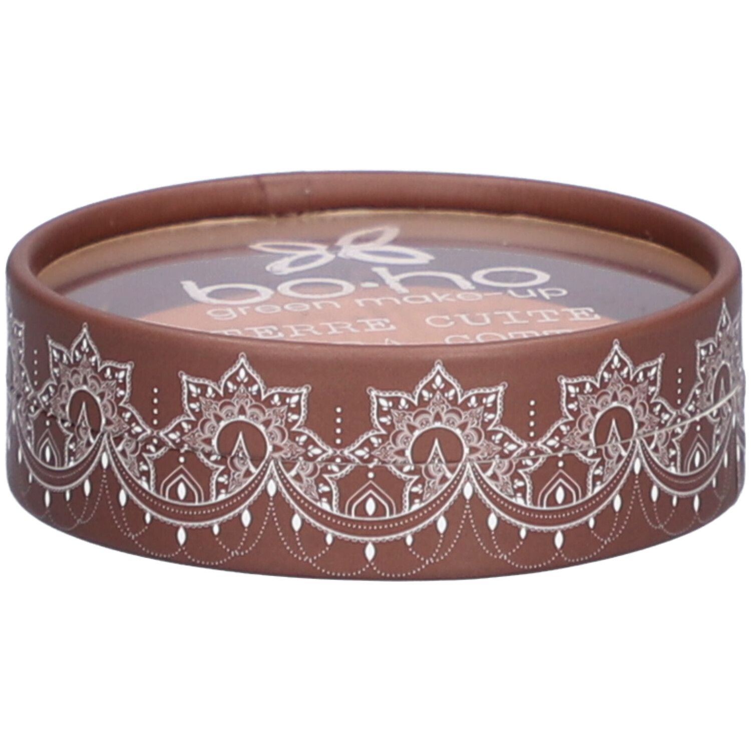 Emballage rond marron avec motif blanc. Couvercle transparent. Inscription: BOHO, Terre Cuite.
