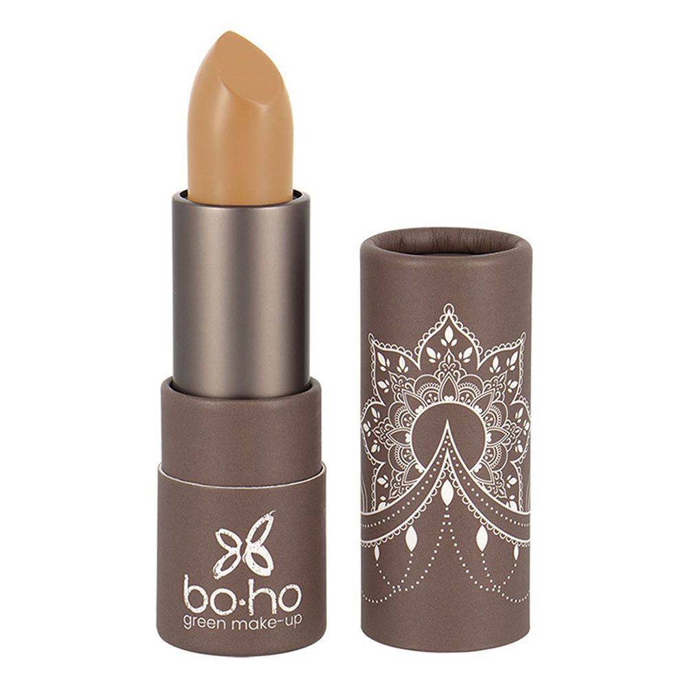 Beige concealer stick, open. Zilverkleurige stick, bruine huls met mandala patroon. Merk: bo-ho green make-up.
