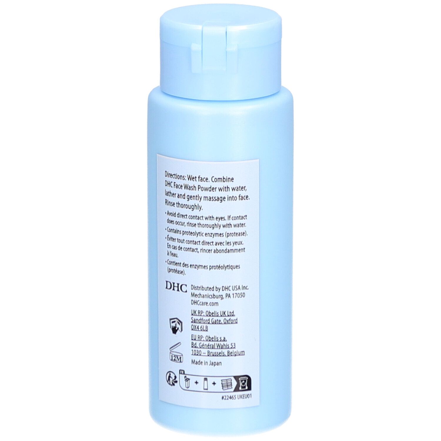 Flacon bleu clair avec bouchon rabattable. Dos avec texte. DHC Face Wash Powder. Instructions.